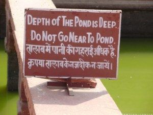 do not go near to the pond sign